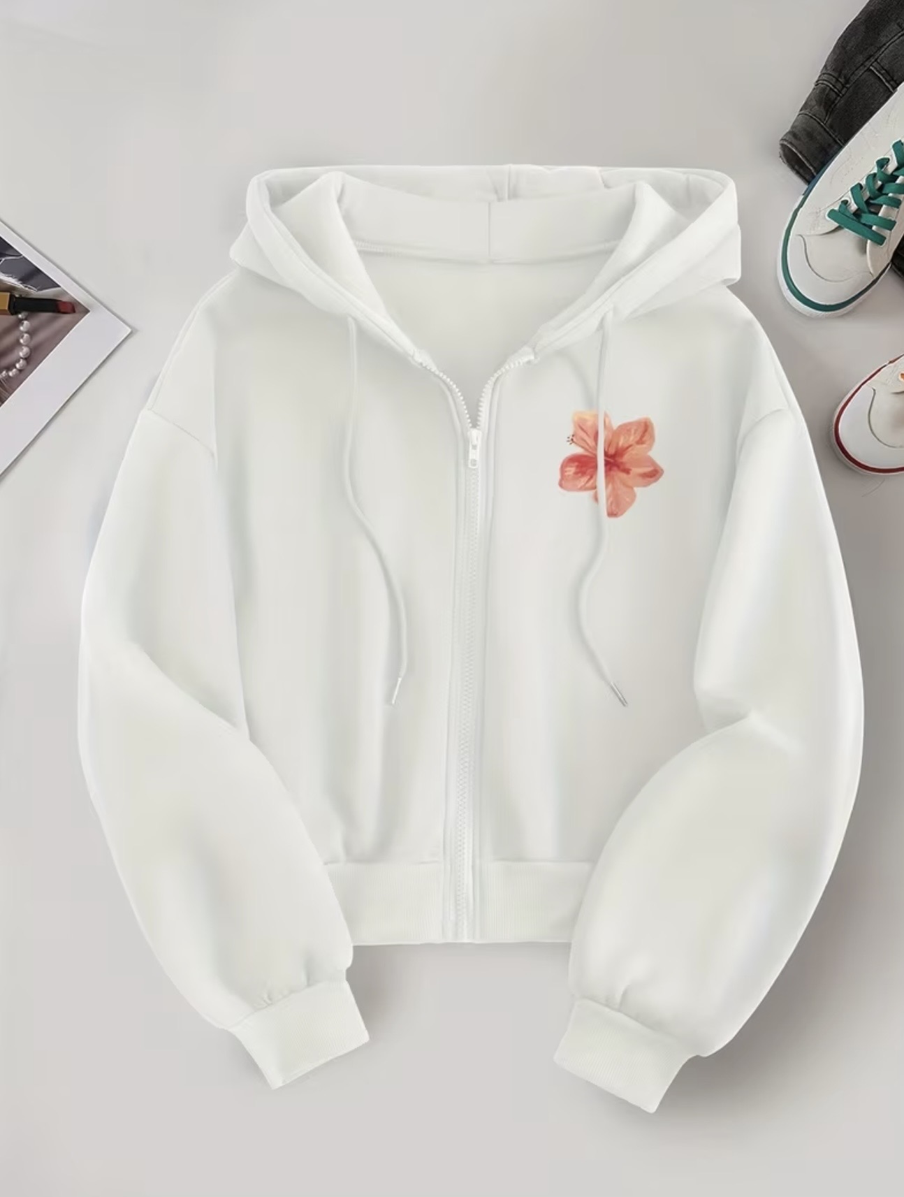 Women's zipper hoodie with a small pink floral graphic on the left chest and a drawstring hood.
