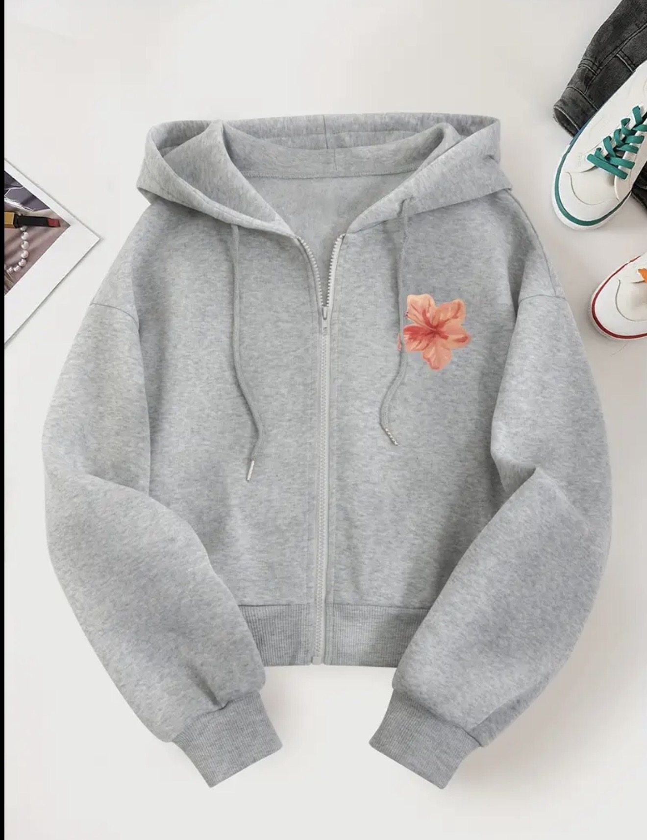 Women's zipper hoodie with a small pink floral graphic on the left chest and a drawstring hood.