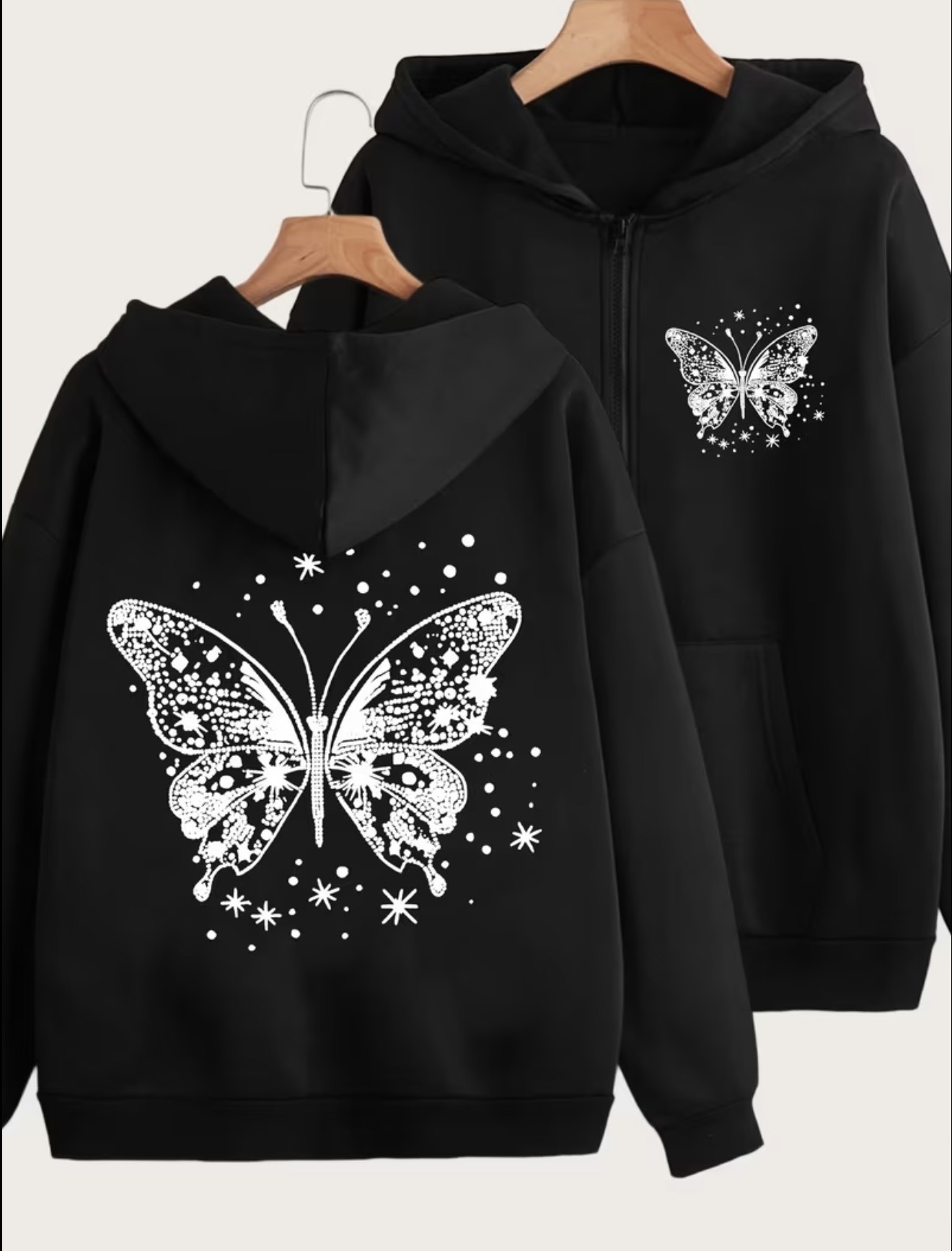 Y2K-style zipper hoodie with a white butterfly and stars back print and a small matching butterfly on the chest.