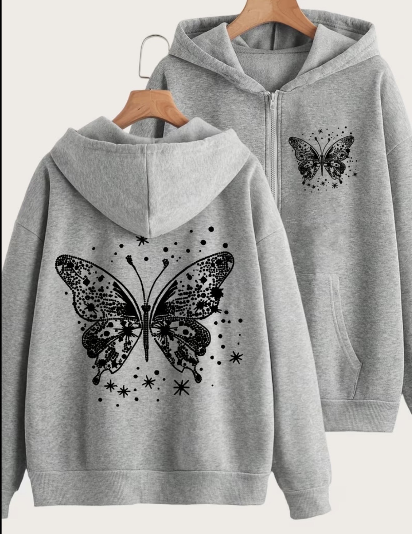 Y2K-style zipper hoodie with a white butterfly and stars back print and a small matching butterfly on the chest.
