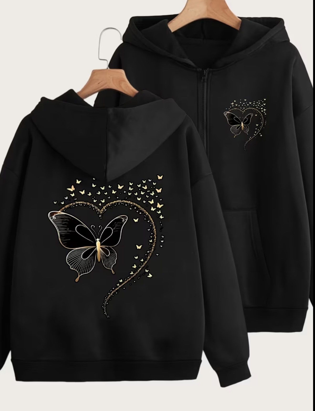 Black women's zip-up hoodie with metallic gold-tone butterfly and heart graphic prints on the front and back.