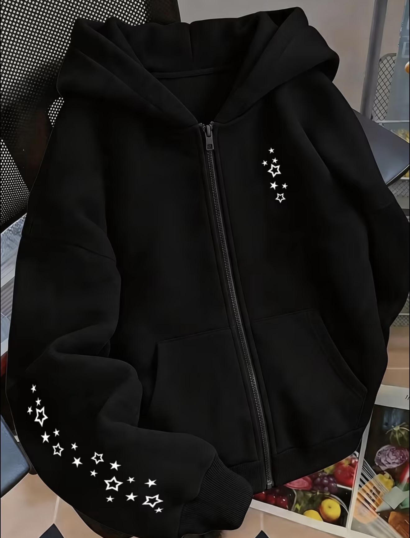 Zip-up hoodie featuring a white star and constellation-style graphic on the right chest and extending across the right sleeve.
