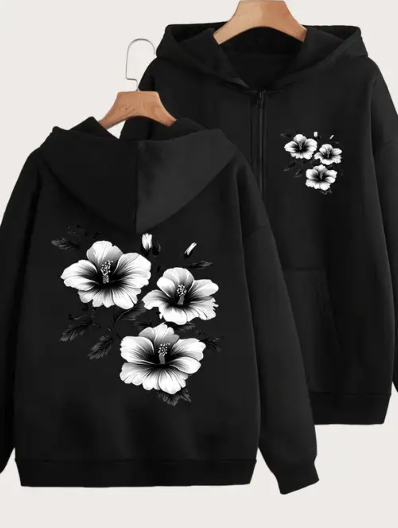 Fleece zipper hoodie with black-and-white hibiscus floral print on the left chest and a large matching flower design on the back.