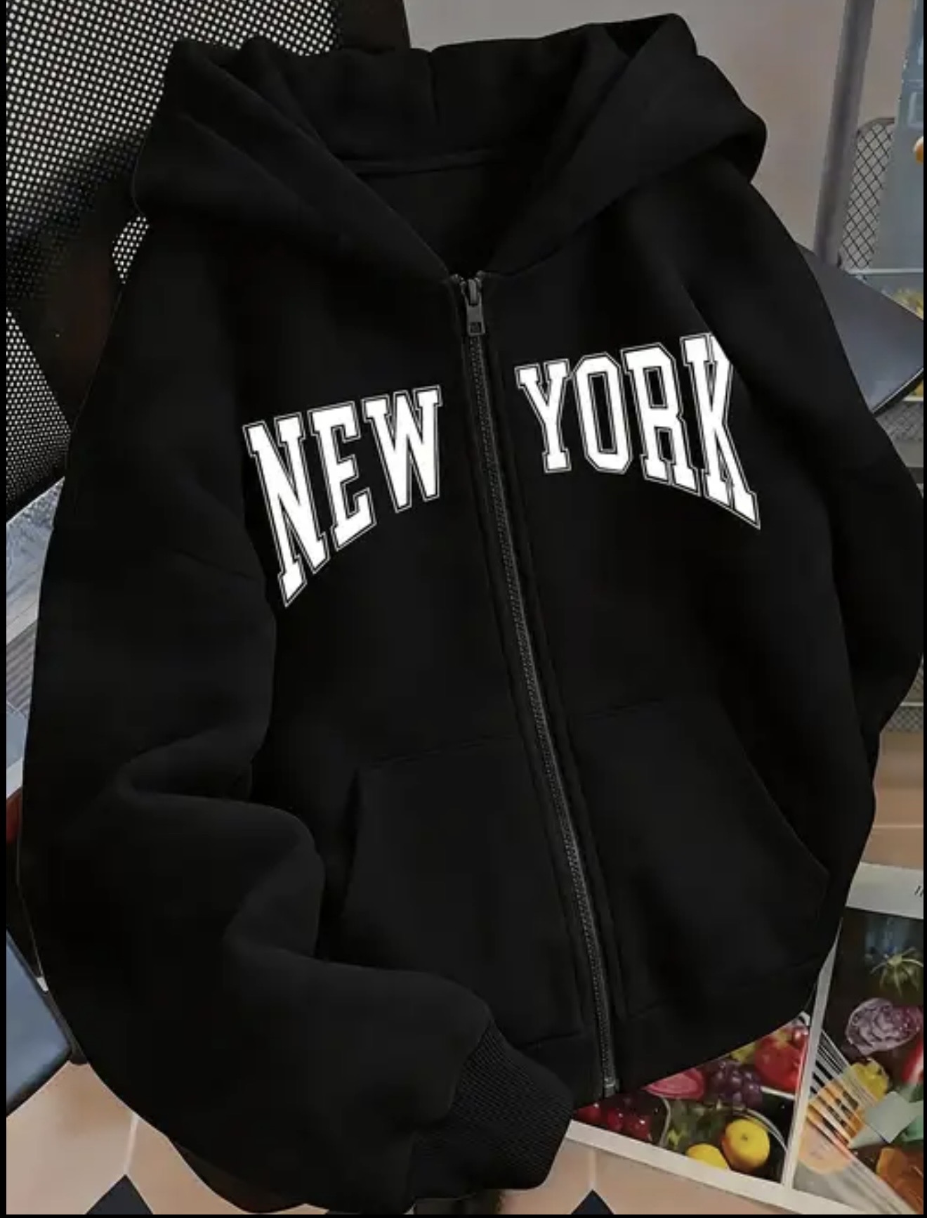 Zip-up hoodie featuring bold black collegiate-style NEW YORK lettering across the chest.