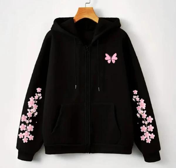 Black zip-up hoodie with pink cherry blossom branch prints on sleeves and a pink butterfly graphic on the chest