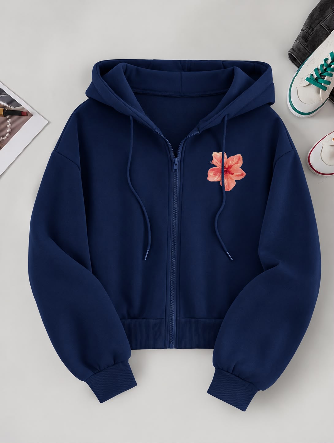 Women's zipper hoodie with a small pink floral graphic on the left chest and a drawstring hood.